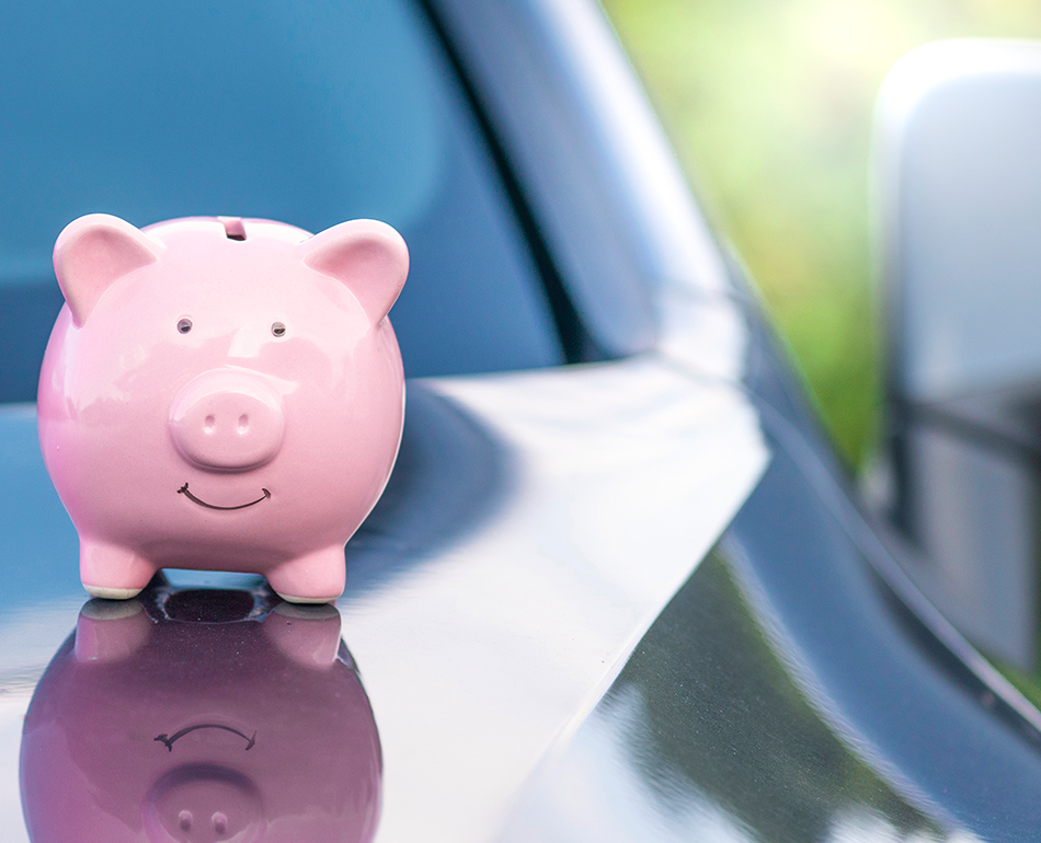 Piggy bank on top of a car